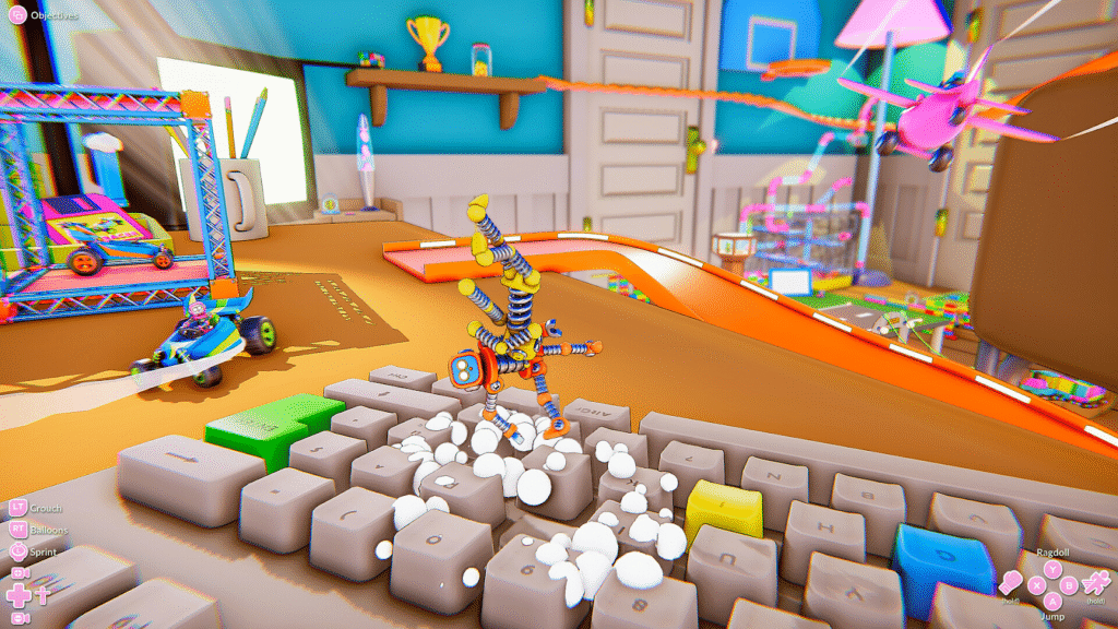 Screenshot from “Just A Guy” featuring a small bendy robot stumbling across an oversized computer keyboard in a cluttered physics-driven sandbox room.